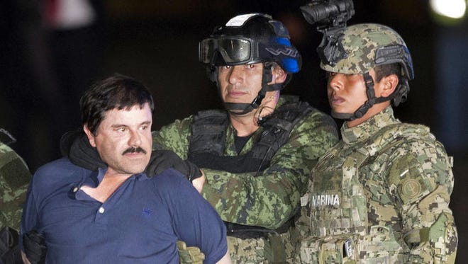 Joaquin "El Chapo" Guzman is made to face the press as he is escorted to a helicopter at a federal hangar in Mexico City in January.
