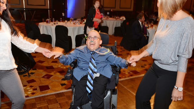 Angel View client Greg Bryan enjoyed dancing with friends.