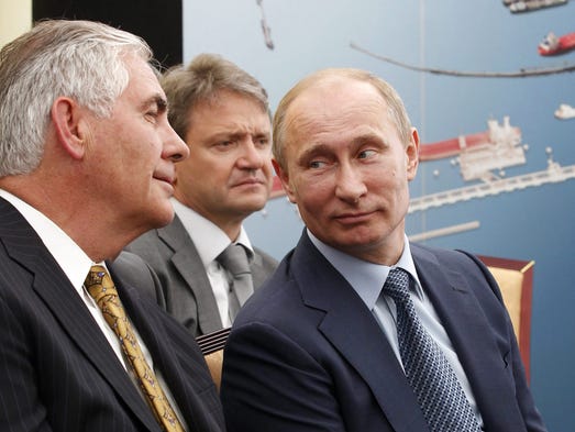 Tillerson and Putin attend a ceremony after the signing
