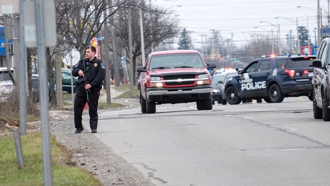 Police block off a section of Martin Luther King Jr. Blvd. as they pursue an armed suspect Saturday March 31, 2018. 