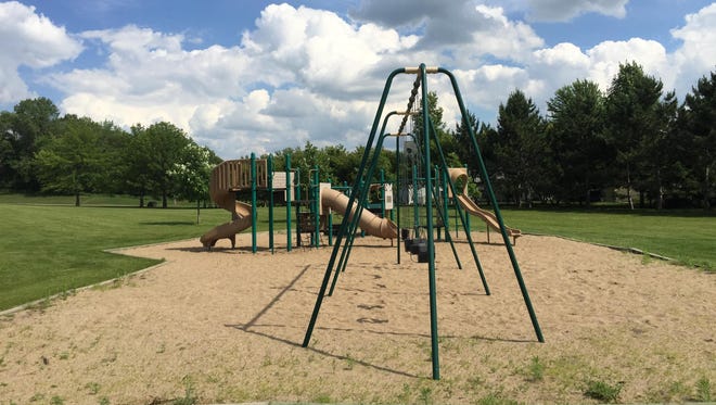 A view of the swing sets and playground equipment at Kiwanis Park in Southeast St. Cloud.