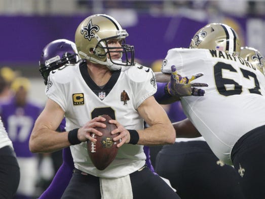 Saints quarterback Drew Brees drops back to pass against