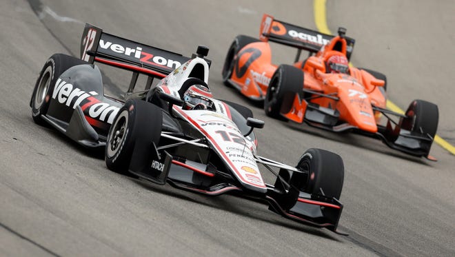 Will Power and Simon Pagenaud, right, practice at Iowa Speedway on Friday.