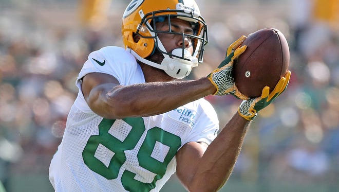 Green Bay Packers wide receiver Michael Clark (89) catches the ball during training camp Monday, July 31, 2017 at Ray Nitschke Field.