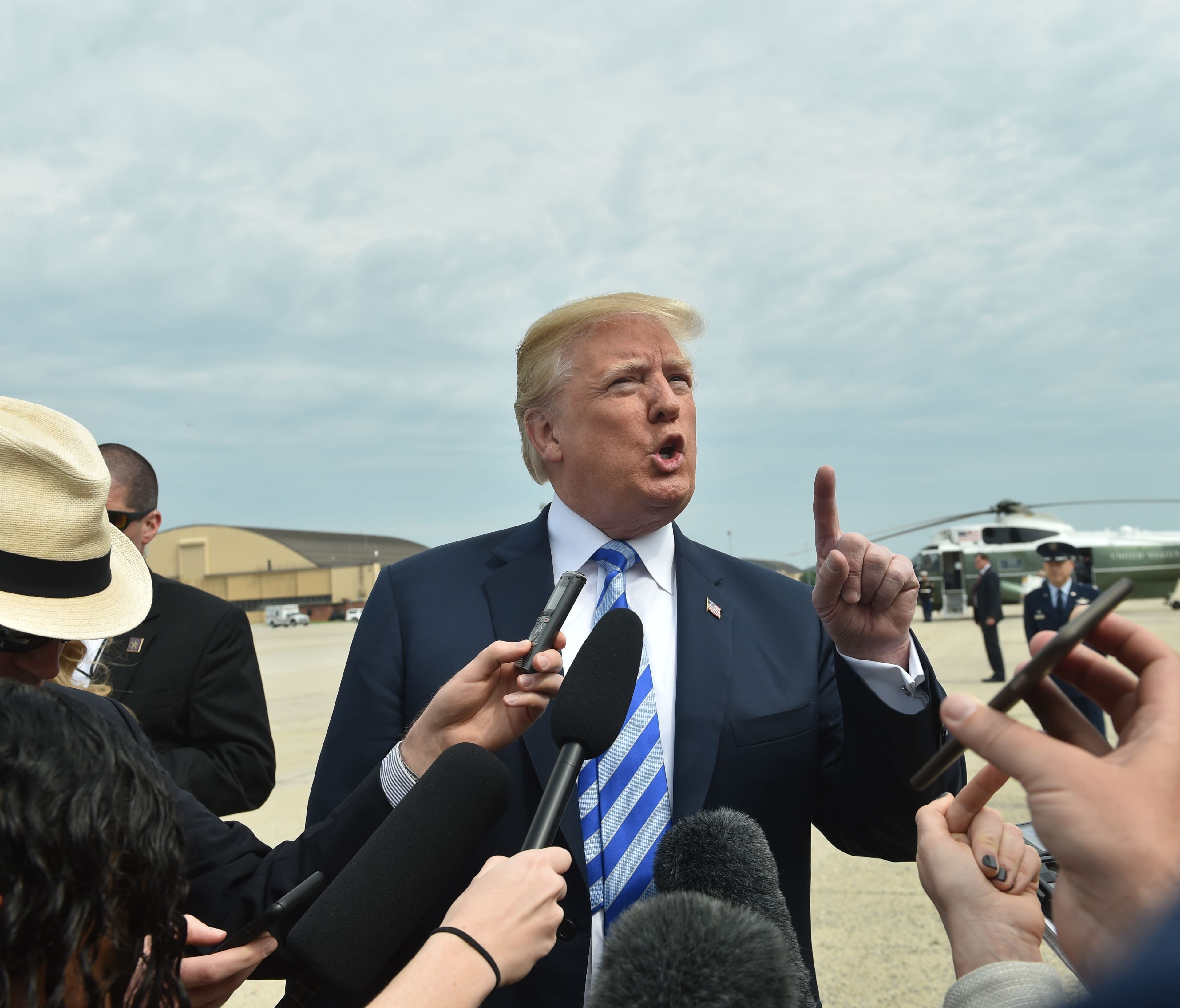 TOPSHOT - US President Donald Trump speaks to the press as he arrives at Dallas Love Field Airport on May 4, 2018 in Dallas, Texas. / AFP PHOTO / Nicholas KammNICHOLAS KAMM/AFP/Getty Images ORIG FILE ID: AFP_14K15Q