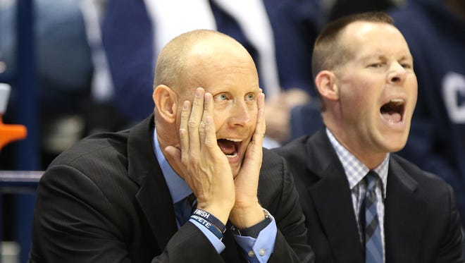 Xavier assistant coach Luke Murray, left, head coach Chris Mack and associate head coach Travis Steele watch the Musketeers take on Northern Iowa at the Cintas Center Center Saturday November 26, 2016.