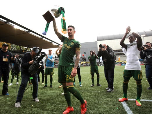 Portland Timbers defender Liam Ridgewell (24) raises