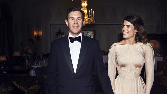 In this photo released on Saturday, Oct. 13 2018 by Buckingham Palace, Britain's Princess Eugenie of York and Jack Brooksbank are photographed at Royal Lodge, Windsor, England, ahead of the private evening dinner, following their Wedding.