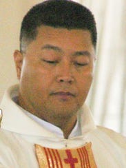 Father Raymond Cepeda is shown in this June 5, 2004