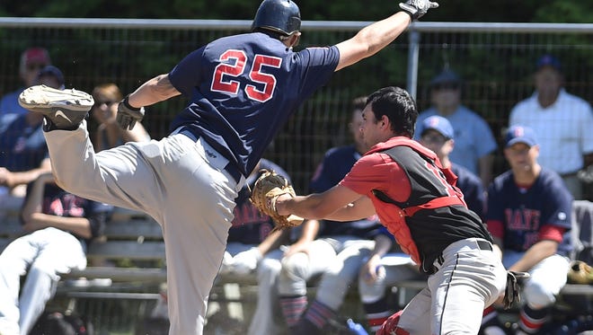 Sister Bay's Bubba Laughlin attempts to complete an inside-the-park home run but is caught at home by catcher Eric Lardinois of Kolberg during a Door County League game at Kolberg on Sunday.
