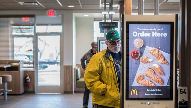 A customer orders from a kiosk at the newly constructed McDonald's Restaurant, 1725 E. Main St., near downtown Richmond on Friday, Jan. 26, 2018.