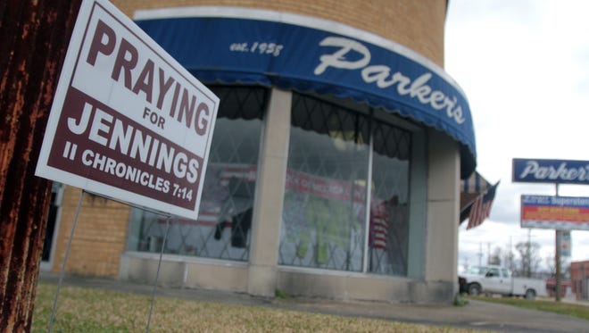 A sign that reads "Praying for Jennings" is seen in 2011.