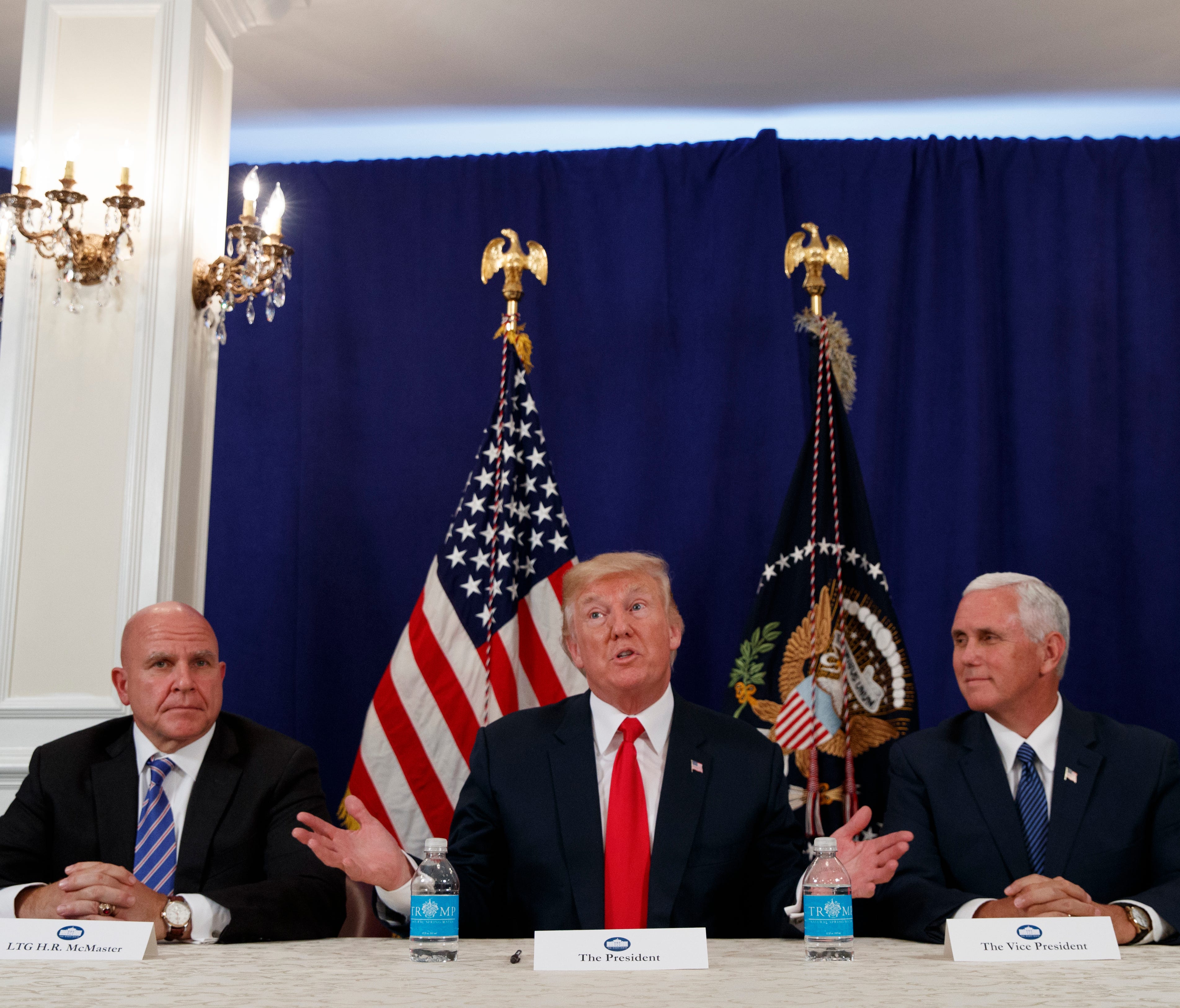 President Donald Trump, flanked by National Security Adviser H.R. McMaster, left, and Vice President Mike Pence, speaks to reporters after a security briefing at Trump National Golf Club in Bedminster, N.J., Thursday, Aug. 10, 2017.