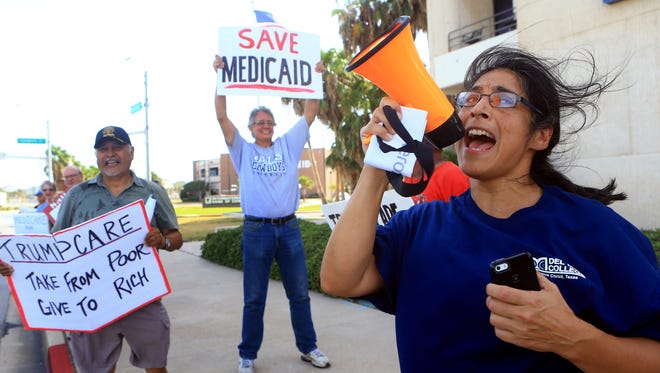 Isabel Araiza shouts with other protesters outside of Congressman Blake Farenthold's office in support of the Medicare For All March on Monday, July 24, 2017, in Corpus Christi.