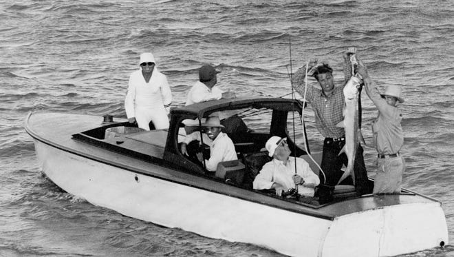 President Franklin D. Roosevelt caught a four-foot tarpon off Port Aransas on May 3, 1937. His son Elliott and fishing guide Barney Farley hold up the fish. The photo was taken by Doc McGregor.