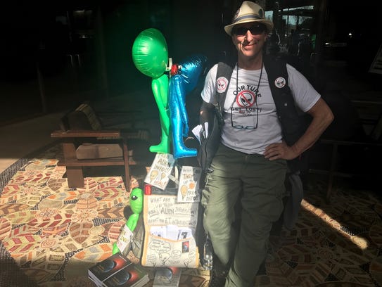 Justin Kohn hands out free information on aliens and