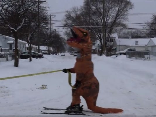 dinosaur chasing jeep