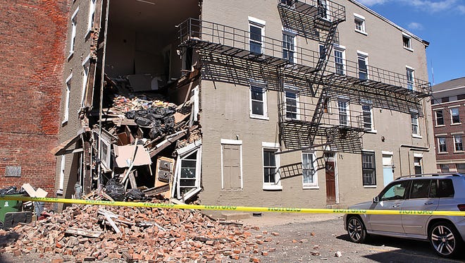A vacant building at near the corner of Walnut and 13th streets partially collapsed Sunday just after 1 p.m. Cincinnati police reported that no one was injured. Walnut Street was closed for several hours.