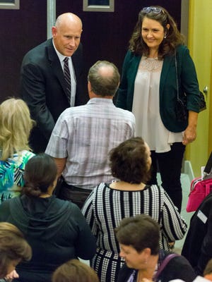 Newly appointed City Manager Stuart Ed, left, and his wife, Bev Ed, shake hands with residents and dignitaries on Monday, Nov. 7, 2016, during a meet-and-greet at Las Cruces City Hall.