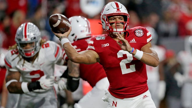 FILE - In this Sept. 28, 2019, file photo, Nebraska quarterback Adrian Martinez (2) throws a pass during the first half of an NCAA college football game against Ohio State, in Lincoln, Neb. Nebraska starts the week of its trip to unbeaten Minnesota facing uncertainty about the health of two of its top players, quarterback Adrian Martinez and receiver JD Spielman. (AP Photo/Nati Harnik, File)