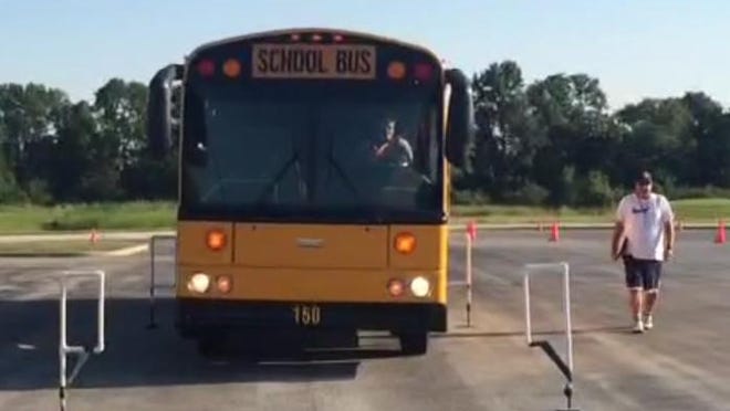 Pat Waites, assistant transportation director for Hamilton Southeastern School District, navigates a bus course on Aug. 4, 2015.