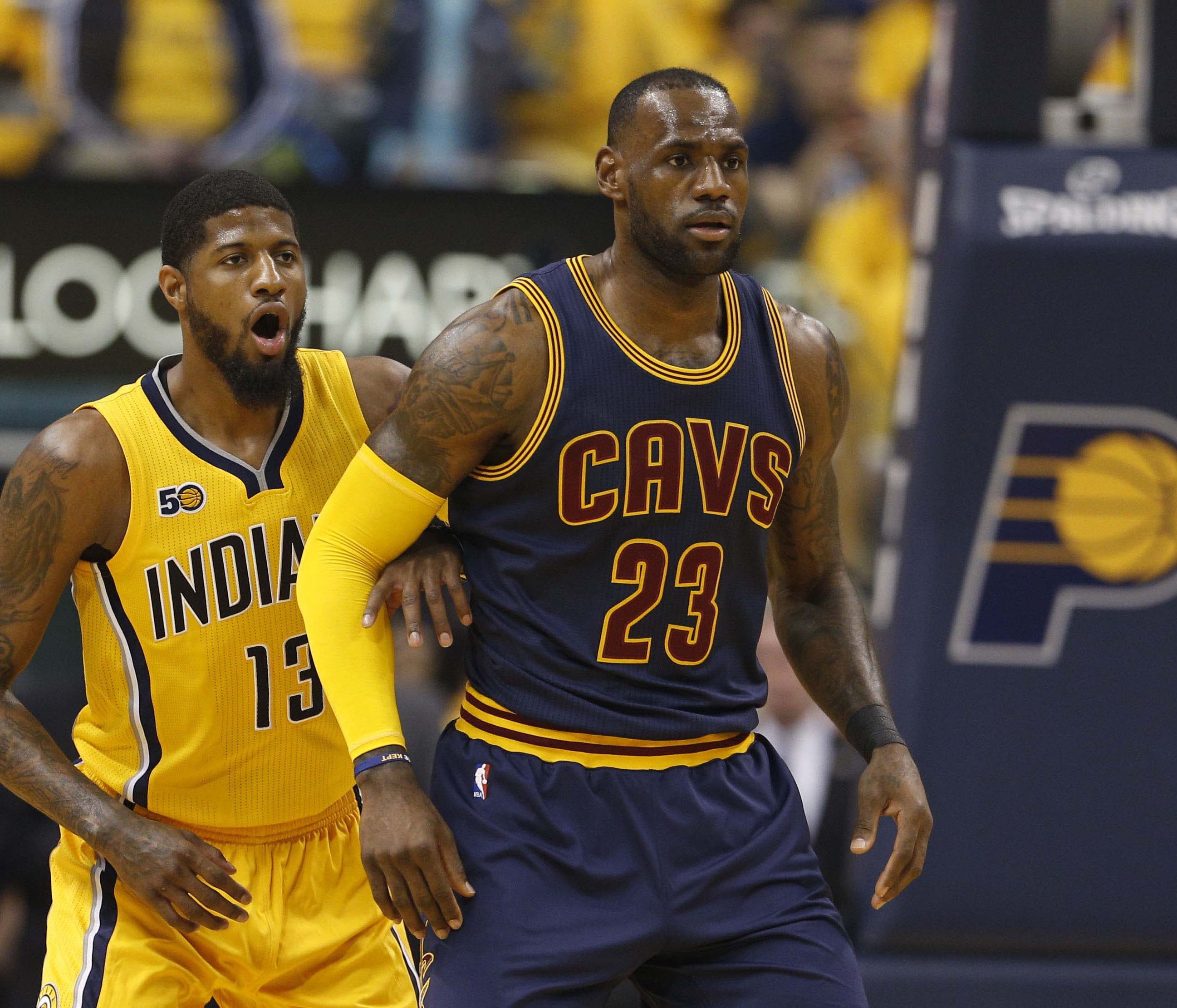 Apr 20, 2017; Indianapolis, IN, USA; Cleveland Cavaliers forward LeBron James (23) is guarded by Indiana Pacers forward Paul George (13) in game three of the first round of the 2017 NBA Playoffs at Bankers Life Fieldhouse. Mandatory Credit: Brian Spu
