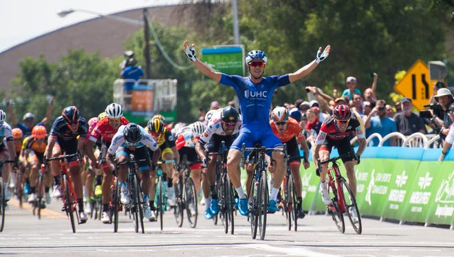 UnitedHealthcare Pro Cycling's Travis McCabe celebrates after winning the first stage of the Tour of Utah in Cedar City Tuesday, August 7, 2018.