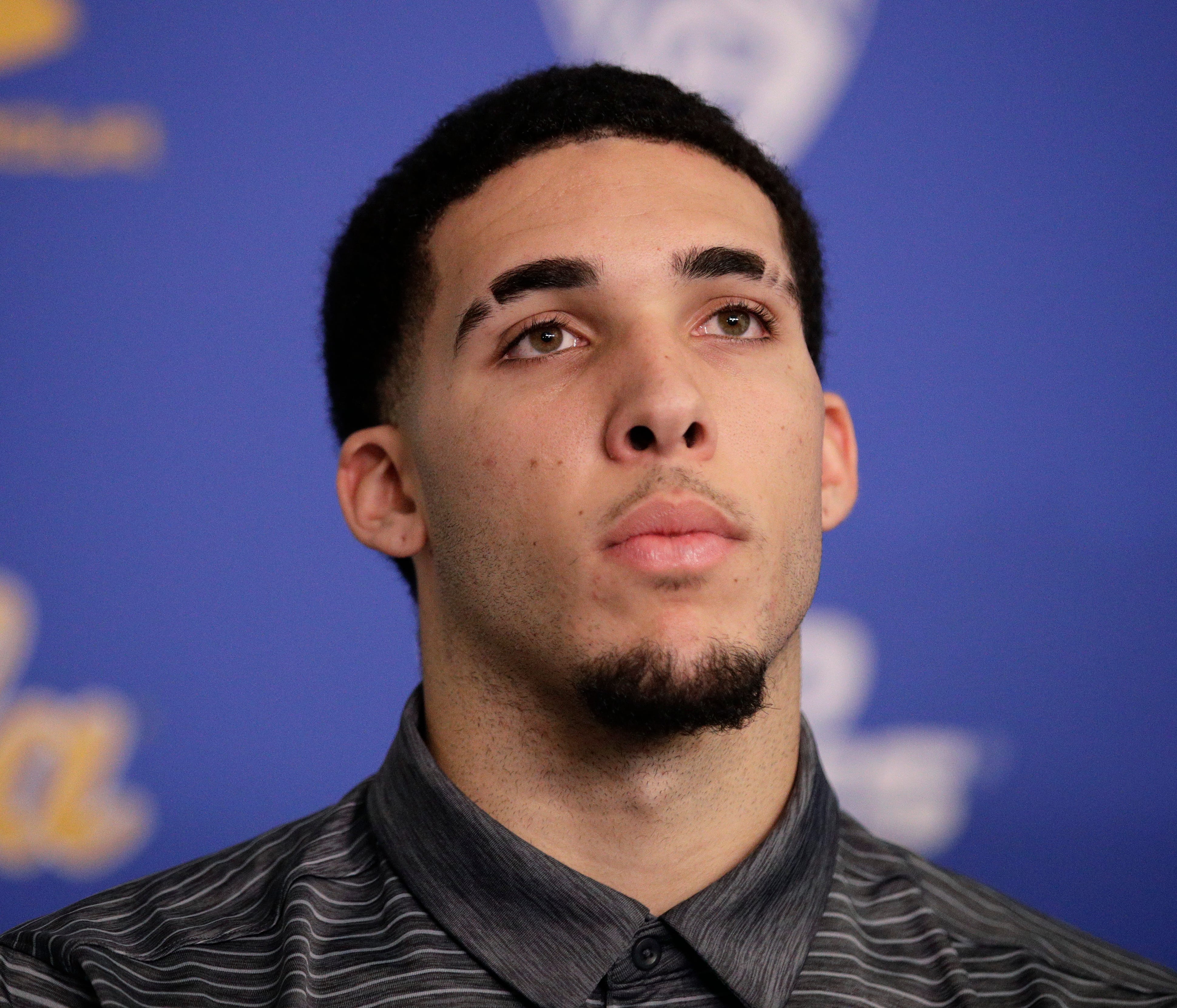 FILe -In this Wednesday, Nov. 15, 2017, file photo, UCLA NCAA college basketball player LiAngelo Ball attends a news conference at UCLA in Los Angeles. The father of UCLA guard LiAngelo Ball says he's withdrawing his son from school so he can prepare