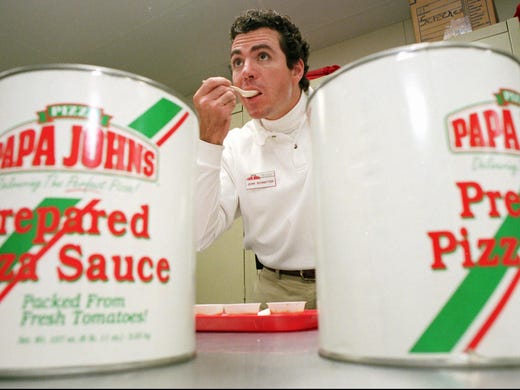 Papa John's founder John Schnatter tastes a spoonful