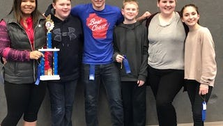 STEM Institute’s Odyssey of the Mind team members, from left, Zoe Perkins, Jared Ott, Mason McGrath, Nathan Ott, Kennedy George, and Ruby Riegert are shown here after their performance at State on March 17, 2018, where they took first place in Division 3 earning them an invitation to the World Finals in Ames, Iowa.