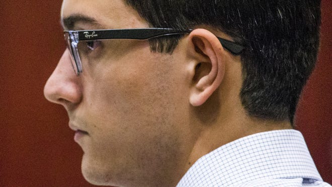 Steven Jones, the former Northern Arizona University student accused of killing one student and injuring three others during an incident in Flagstaff in 2015, listens to opening arguments in his murder trial in Coconino County Superior Court, Wednesday, April 5, 2017.