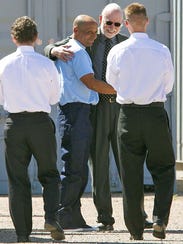 Louis Taylor (second from left), who was convicted