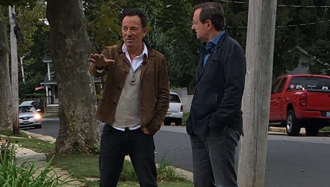 Bruce Springsteen and CBS reporter Anthony Mason on Randolph Street in Freehold on Tuesday, Sept. 6.