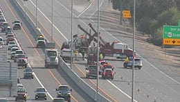 Southbound Loop 101 was closed Monday evening so emergency crews could remove a cement truck that rolled over.