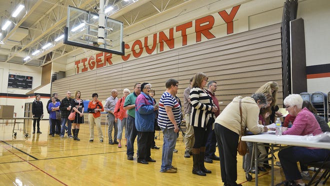 Voters wait in line in the St. Cloud Tech gymnasium just after 5 p.m. Nov. 3 to cast their ballots to decide the outcome of the $167 million District 742 school referendum.