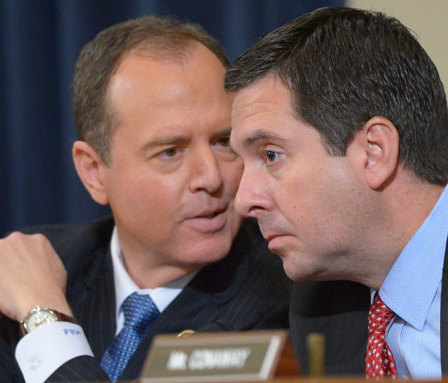 Reps. Adam Schiff, D-Calif., left, and Devin Nunes, R-Calif., talk during a committee hearing in March.