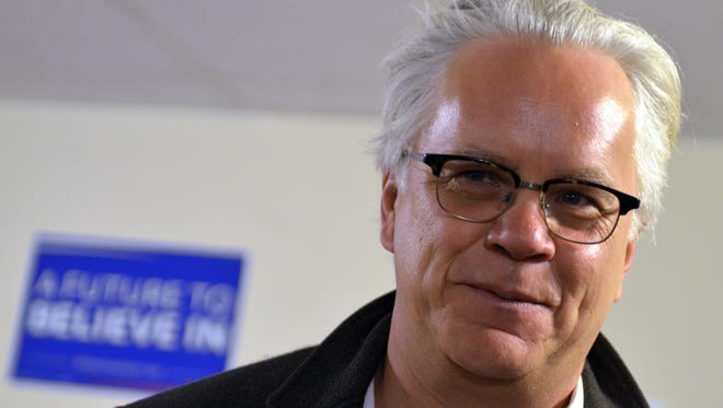 Actor and activist Tim Robbins speaks to a small crowd at the Manitowoc for Bernie campaign headquarters Monday afternoon.