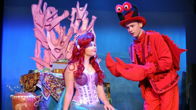 Sebastian the Crab (Nate Jones) visits Ariel (Colby Ann Smith) in her grotto and warns her to not visit the land above.