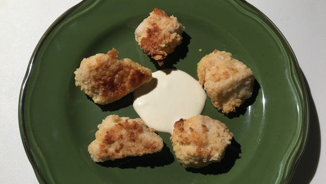 Chicken bites with dipping sauce.