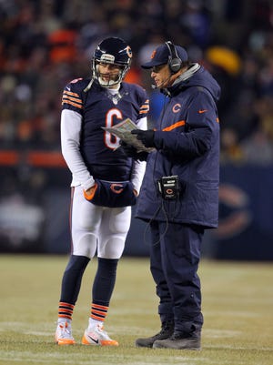 Dec 4, 2014; Chicago, IL, USA; Chicago Bears quarterback Jay Cutler (6) talks with head coach Marc Trestman during the second quarter against the Dallas Cowboys at Soldier Field.