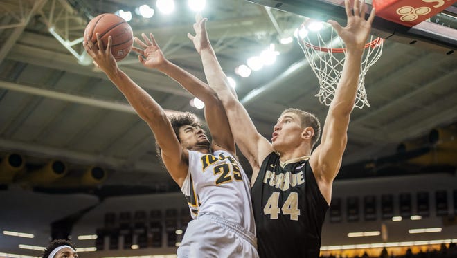 Iowa Hawkeyes forward Dom Uhl (25) goes to the basket against Purdue Boilermakers center Isaac Haas (44) during the first half at Carver-Hawkeye Arena.