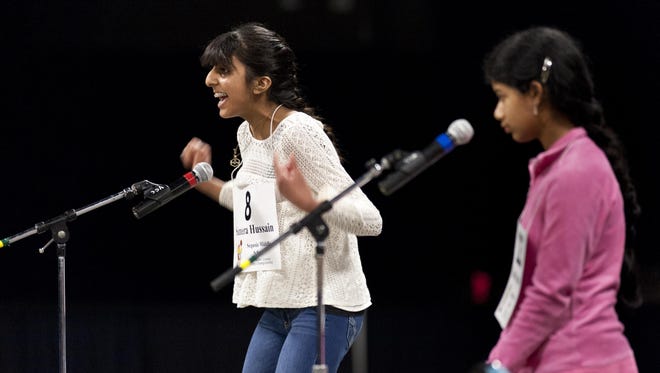 Sameera Hussain celebrates winning the 17th Annual Tulare County Spelling Championship ahead of 239 other spellers at the Visalia Convention Center on Wednesday, February 24, 2016. Her winning word was "sapiential." Yasoda Satpathy, right, placed second.