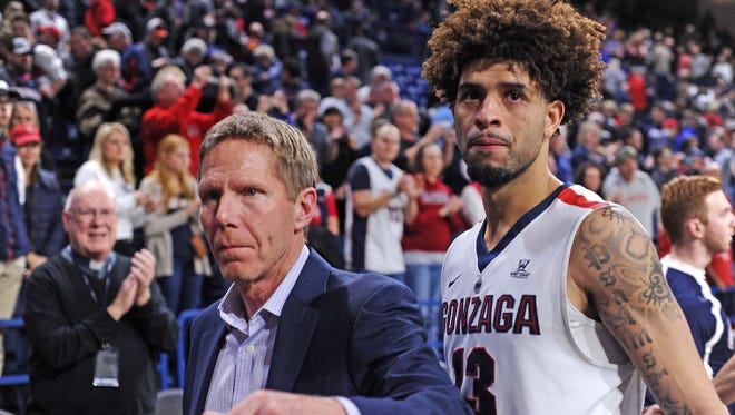 Gonzaga head coach Mark Few, left, could be taking his program to the Mountain West.