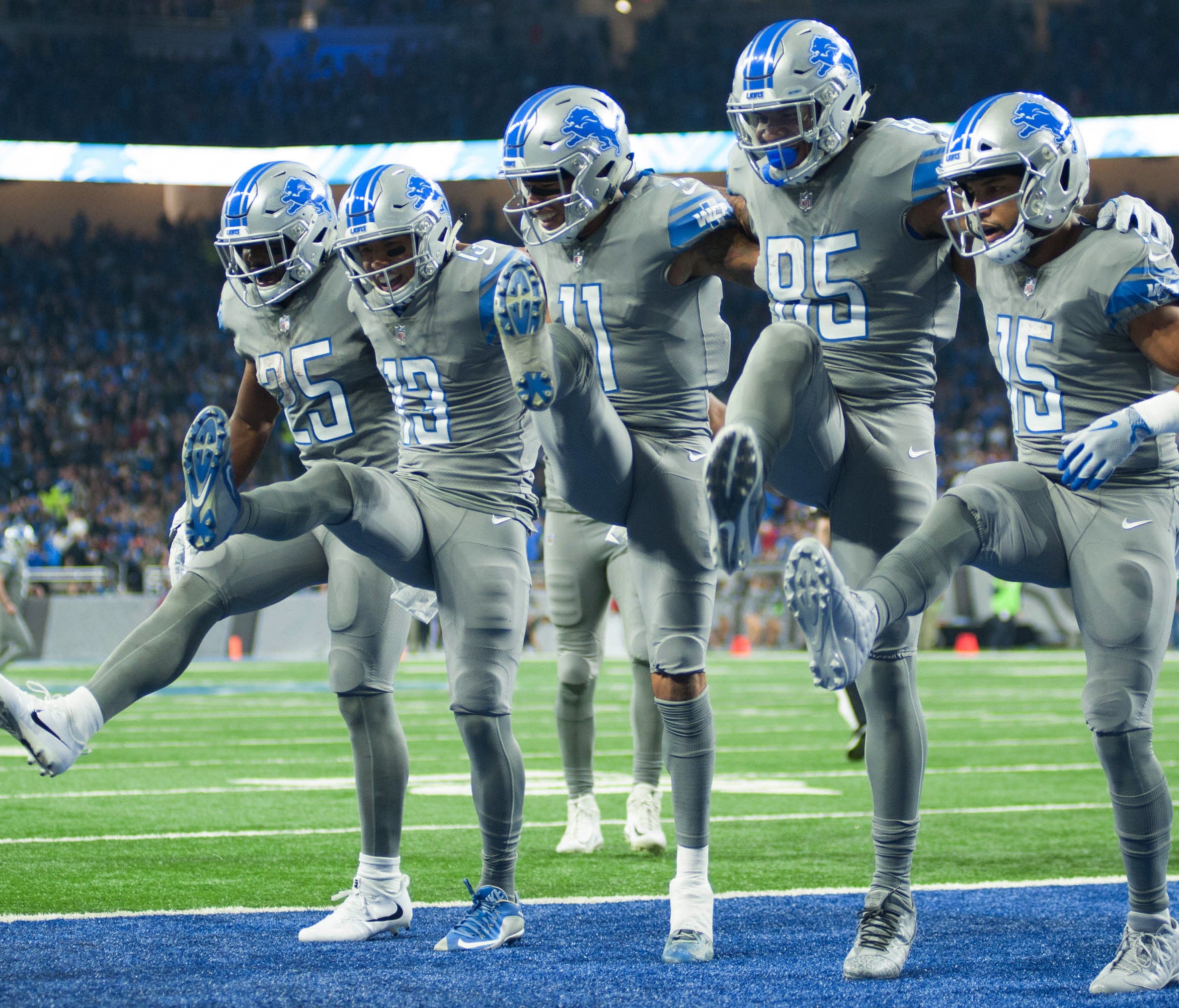 Detroit Lions wide receiver T.J. Jones (13) celebrates his touchdown with running back Theo Riddick (25) wide receiver Marvin Jones (11) tight end Eric Ebron (85) and wide receiver Golden Tate (15) during the second quarter against the Chicago Bears 