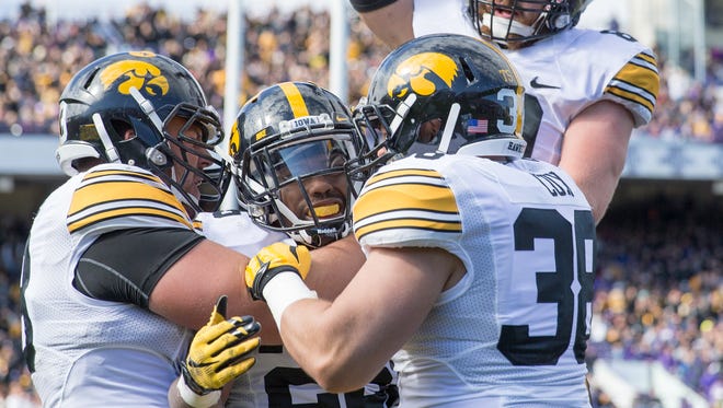 Before he was an emerging talent for Iowa, running back Akrum Wadley, center, was a lightly recruited athlete.