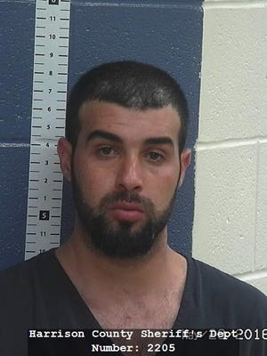 Wisam Fadhil is accused in connection with the slaying of his wife in Louisville. Police arrested him Sunday in Harrison County, Ind., where he's jailed pending extradition.