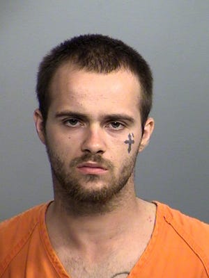 Zameon Niper, 23, is accused of biting IMPD Officer William Bueckers during an arrest on Tuesday.