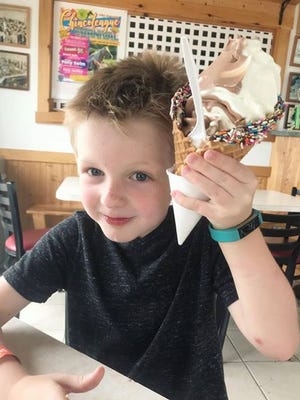 Jaxsen Palmer enjoys an ice cream cone during a recent vacation to Chincoteague, Virginia provided by the Casey Cares Foundation.