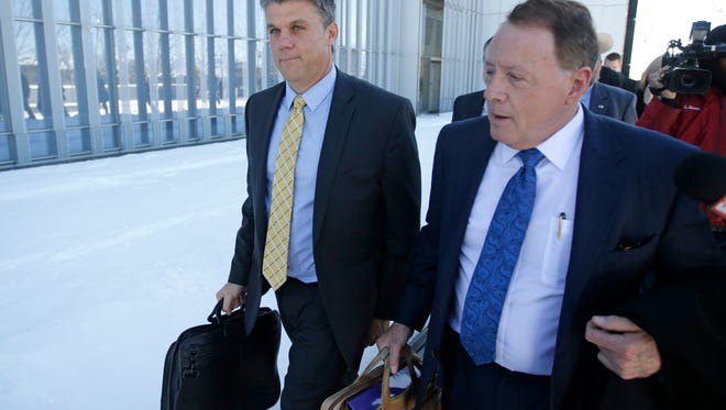 This Dec. 18, 2015, file photo, San Juan County Commissioner Phil Lyman, left, and his attorney Peter Stirba, right, leave the federal courthouse, in Salt Lake City. Lyman, convicted for his role in an ATV protest ride through a protected canyon calls the case against him a "modern-day witch hunt" in documents filed before a federal appeals court.