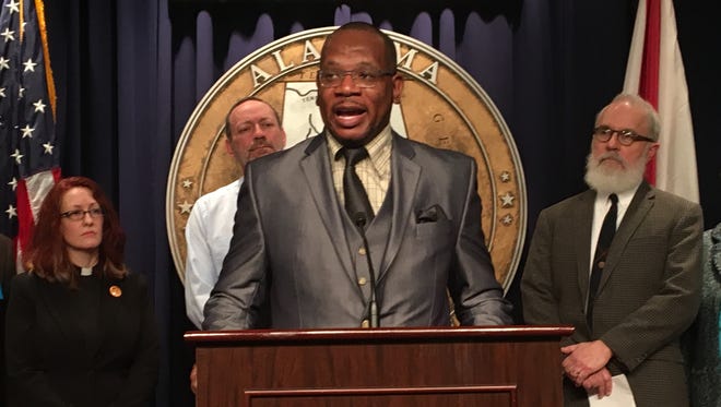 Rev. Marvin Charles Lue, Jr. speaks a press conference on Feb. 2, 2017, urging protection of the Affordable Care Act. Behind Lue (l to r) Minister Monica Dobbins of the Unitarian Universalist Church of Tuscaloosa; Rev. Paul Ecknes-Tucker of the Pilgrim United Church of Christ in Birmingham and Jim Carnes, policy director for Alabama Arise.